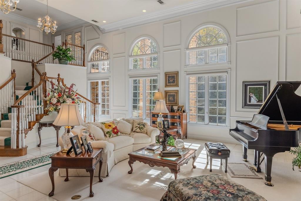 1 Willow Ridge Road Greenville, TX 75402 - Photo 33 of 38 a living room with furniture a chandelier and a large window
