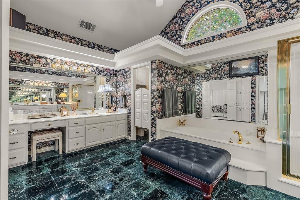 1 Willow Ridge Road Greenville, TX 75402 - Photo 36 of 38 a large spacious bathroom with a double vanity sink a mirror and a bathtub