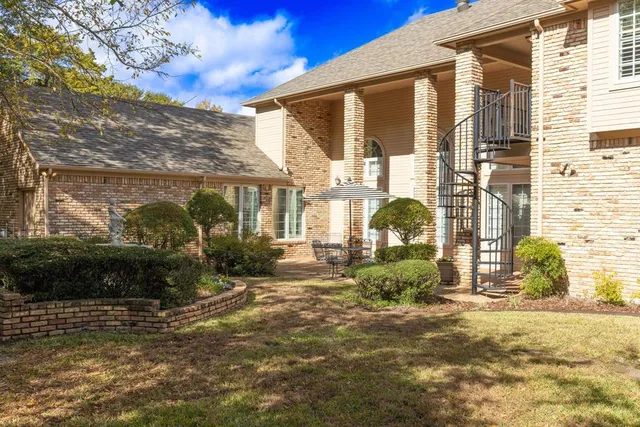a kitchen with stainless steel appliances granite countertop a sink a cabinets and window