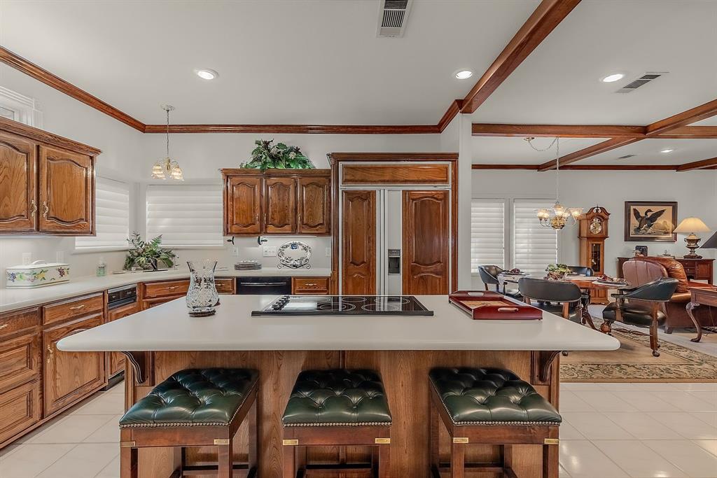 1 Willow Ridge Road Greenville, TX 75402 - Photo 10 of 38 a kitchen with a table chairs stove and cabinets