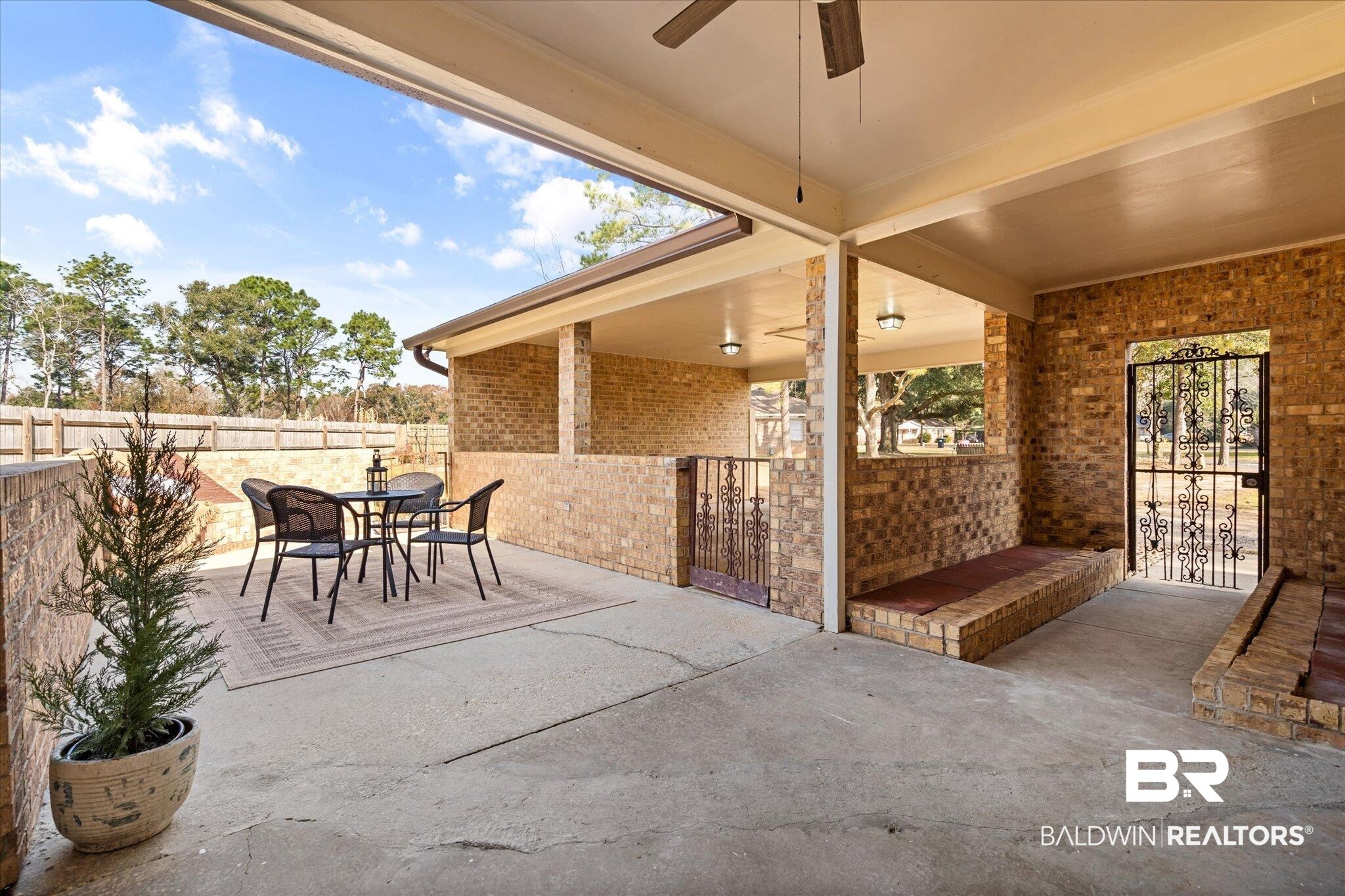6848 Sandra Drive Theodore, AL 36582 - Photo 10 of 21 View of patio featuring ceiling fan