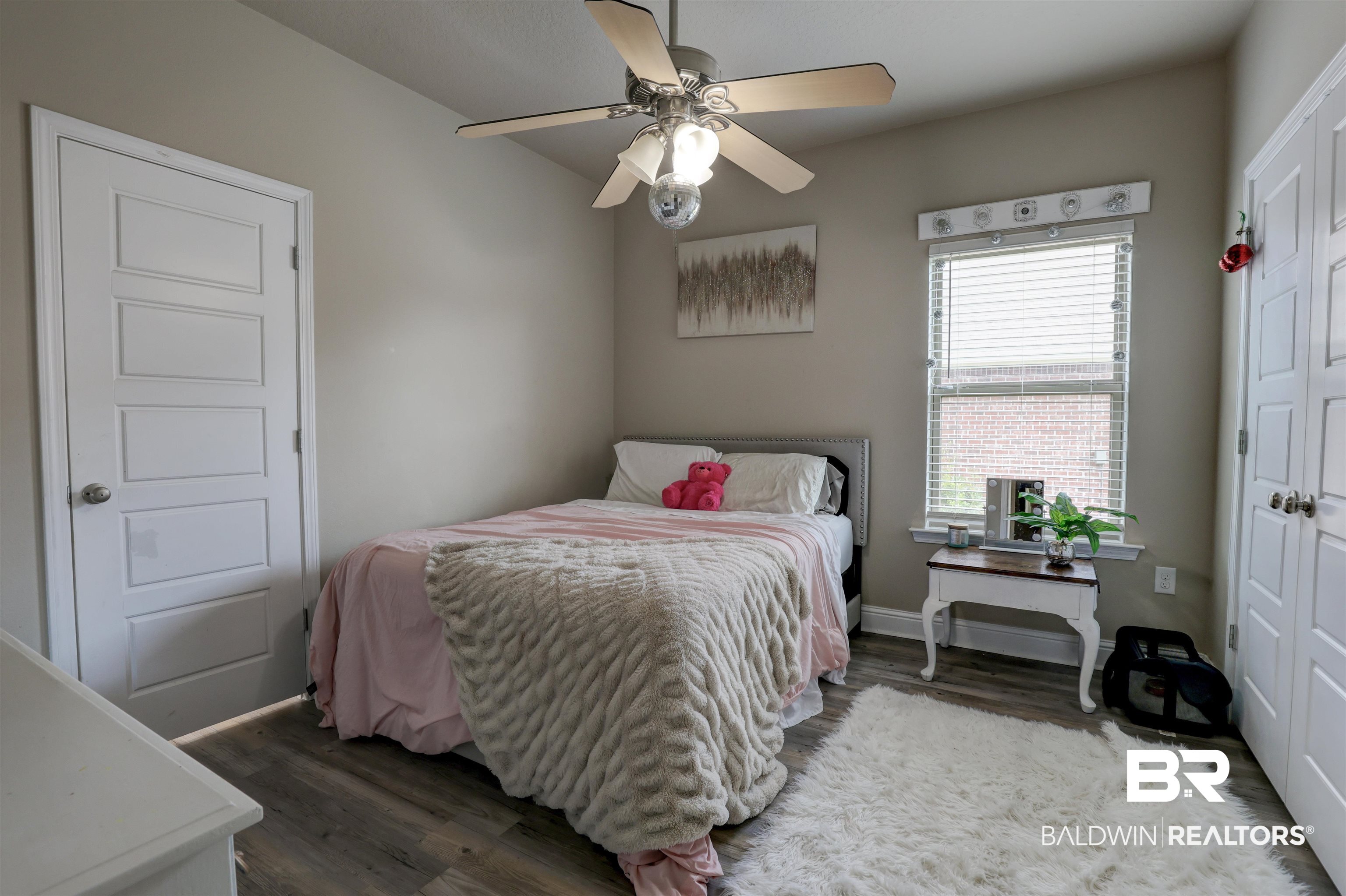 21902 Yosemite Boulevard Fairhope, AL 36532 - Photo 17 of 32 Bedroom with ceiling fan and wood-type flooring