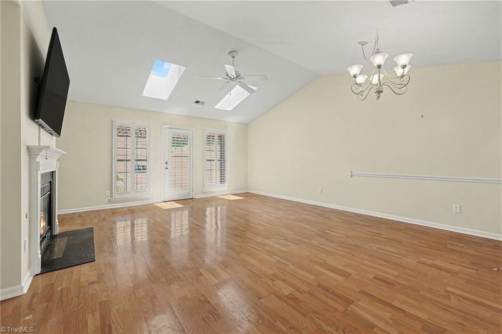 4405 Single Tree Lane High Point, NC 27265 - Photo 6 of 28 Skylight and patio door offer plentiful natural daylight.
