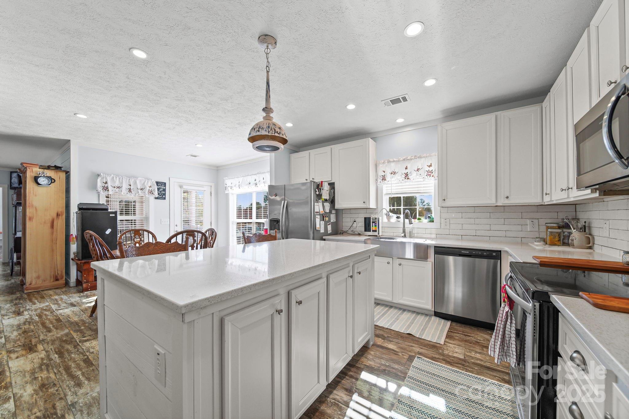 6179 Steen Road Jefferson, SC 29718 - Photo 11 of 26 a kitchen with appliances cabinets and a sink