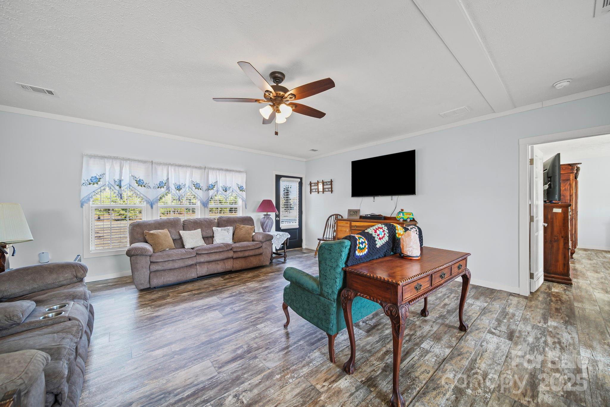 6179 Steen Road Jefferson, SC 29718 - Photo 12 of 26 a living room with furniture and a flat screen tv