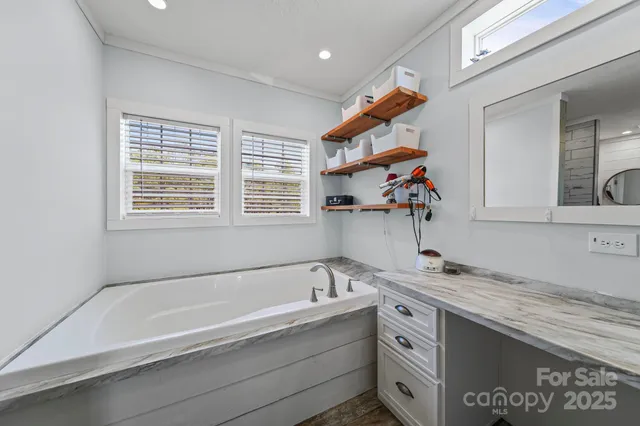 a bathroom with a bathtub and a sink