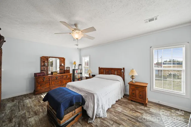 a bedroom with a bed and a table in it