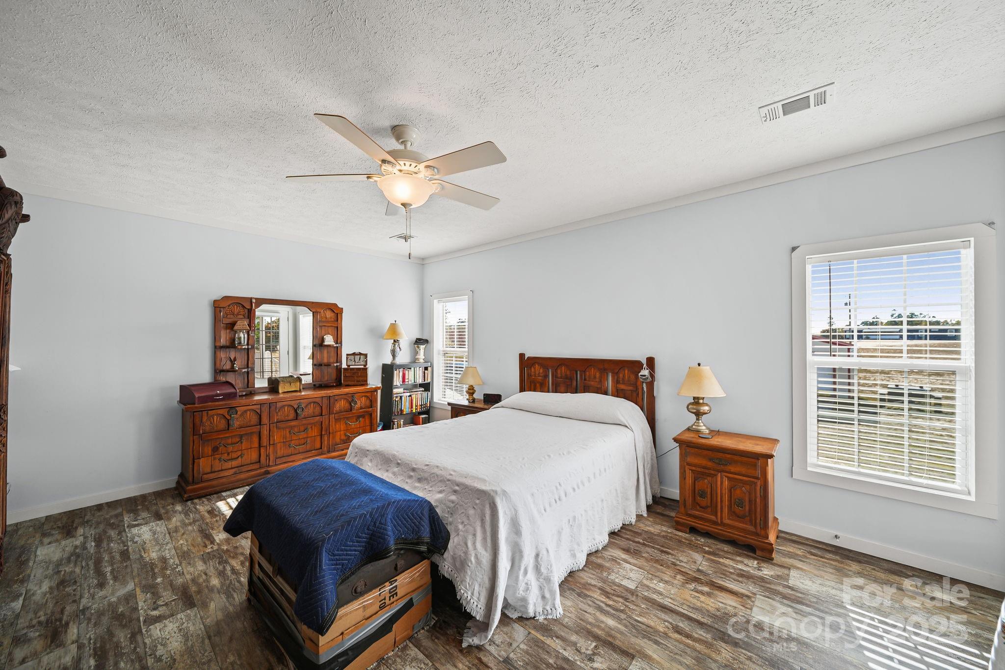 6179 Steen Road Jefferson, SC 29718 - Photo 15 of 26 a bedroom with a bed and a table in it
