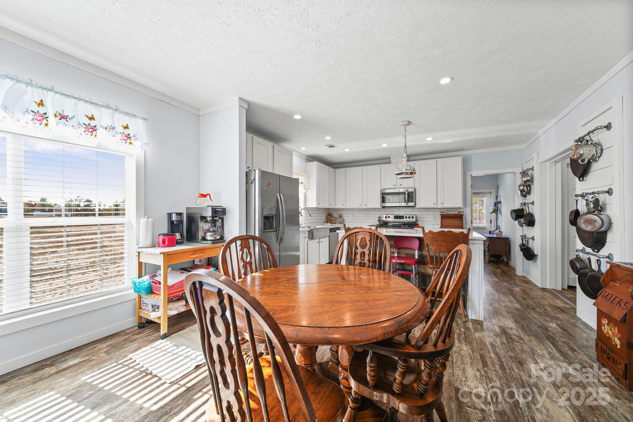 6179 Steen Road Jefferson, SC 29718 - Photo 17 of 26 a view of a dining room with furniture and a window