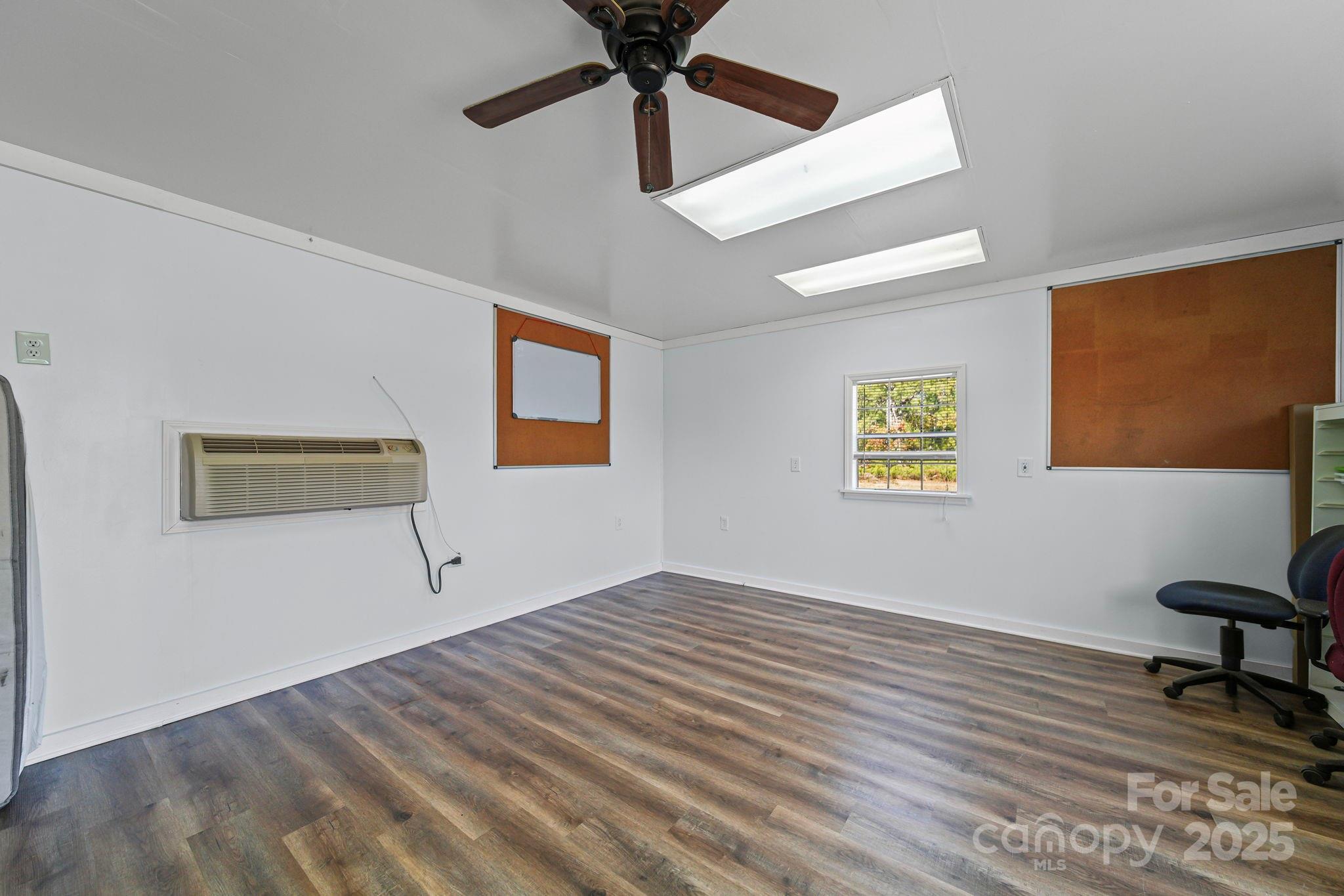 6179 Steen Road Jefferson, SC 29718 - Photo 22 of 26 a view of empty room with wooden floor