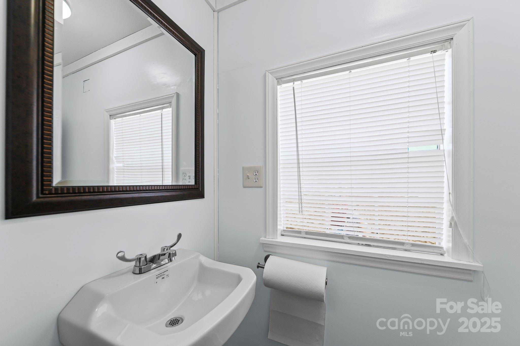6179 Steen Road Jefferson, SC 29718 - Photo 24 of 26 a bathroom with a sink and a window