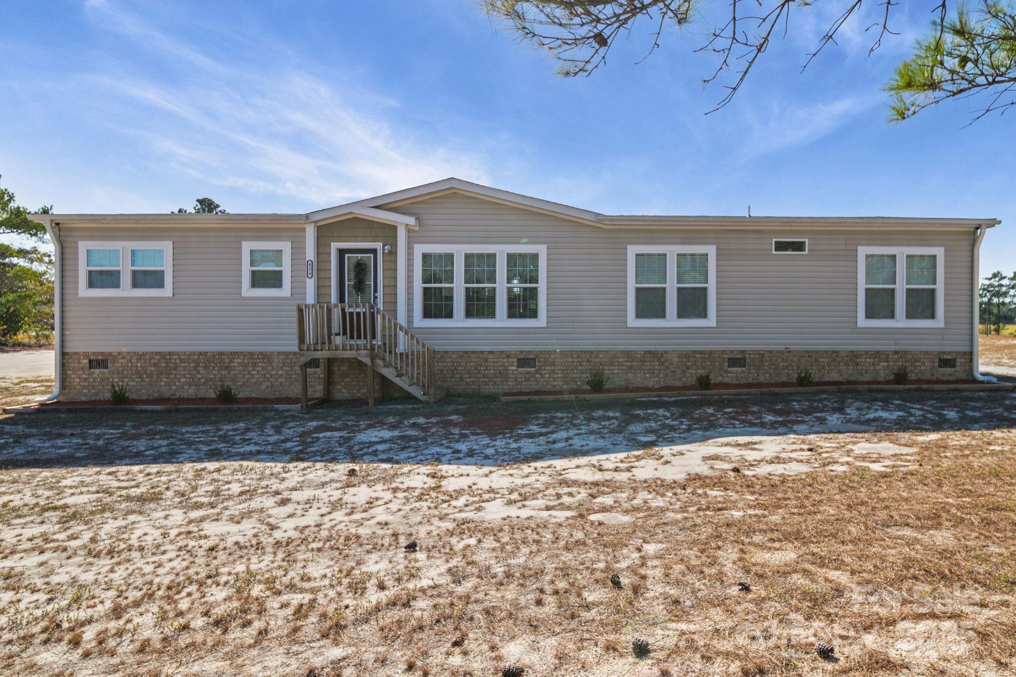 6179 Steen Road Jefferson, SC 29718 - Photo 25 of 26 a front view of a house with a yard