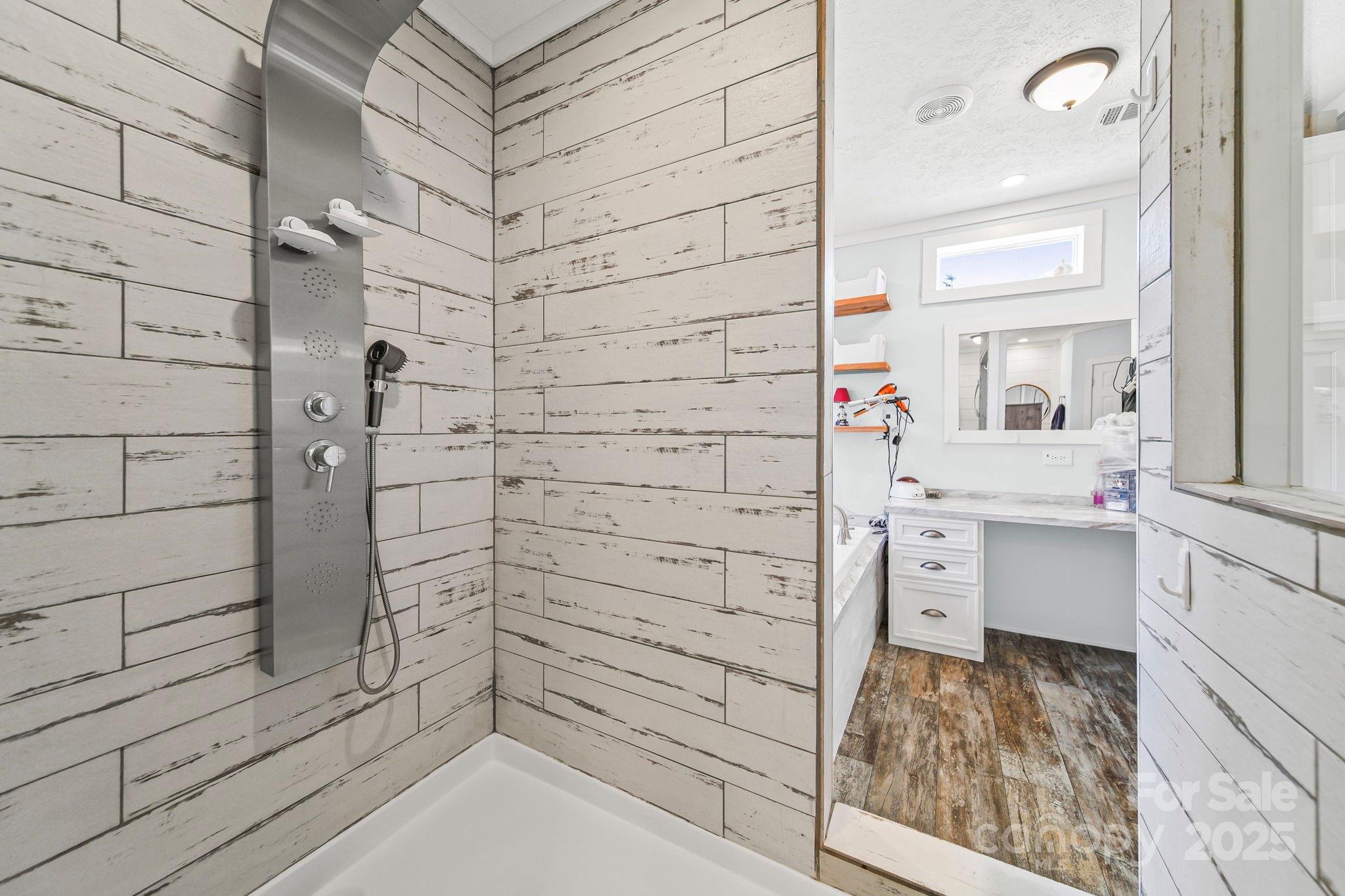 6179 Steen Road Jefferson, SC 29718 - Photo 5 of 26 a bathroom with a bathtub and shower