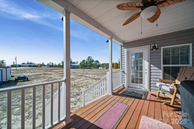 a view of balcony with wooden floor
