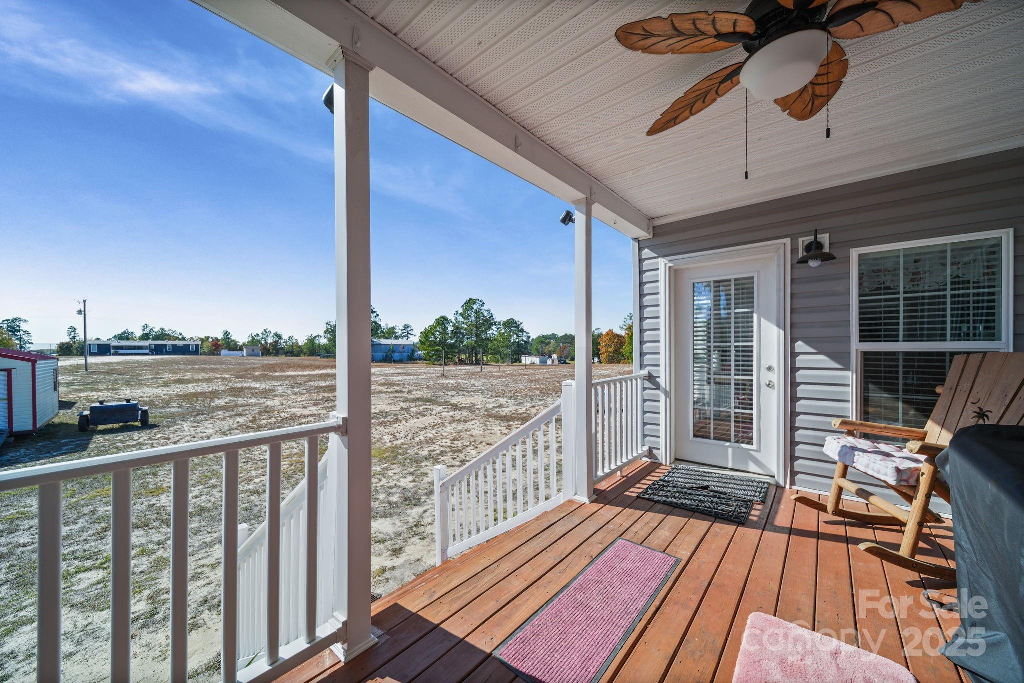 6179 Steen Road Jefferson, SC 29718 - Photo 8 of 26 a view of balcony with wooden floor