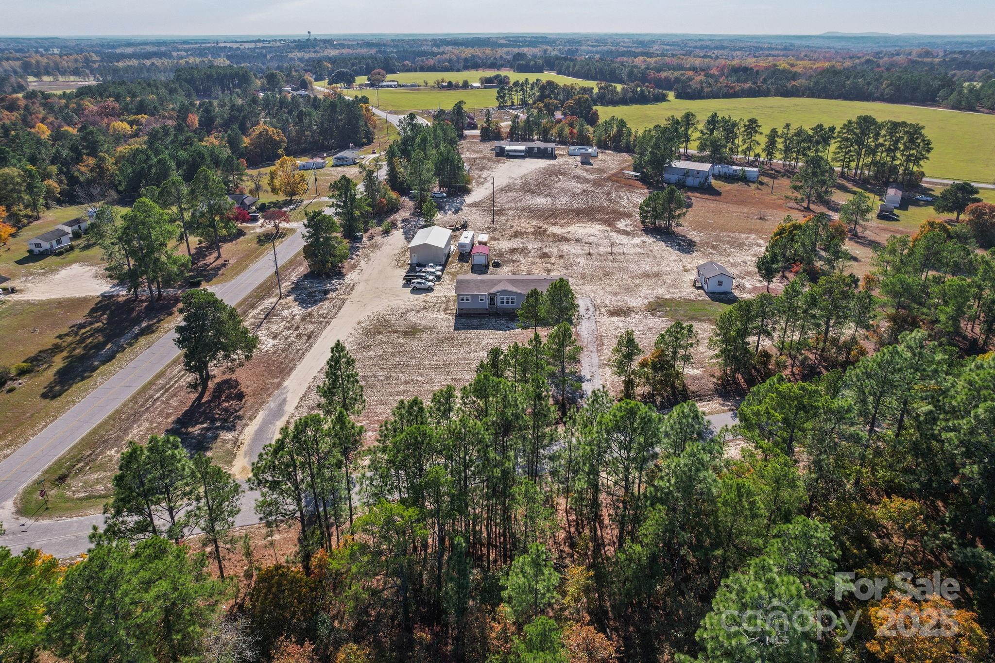 6179 Steen Road Jefferson, SC 29718 - Photo 9 of 26 an aerial view of a house with a yard and lake view