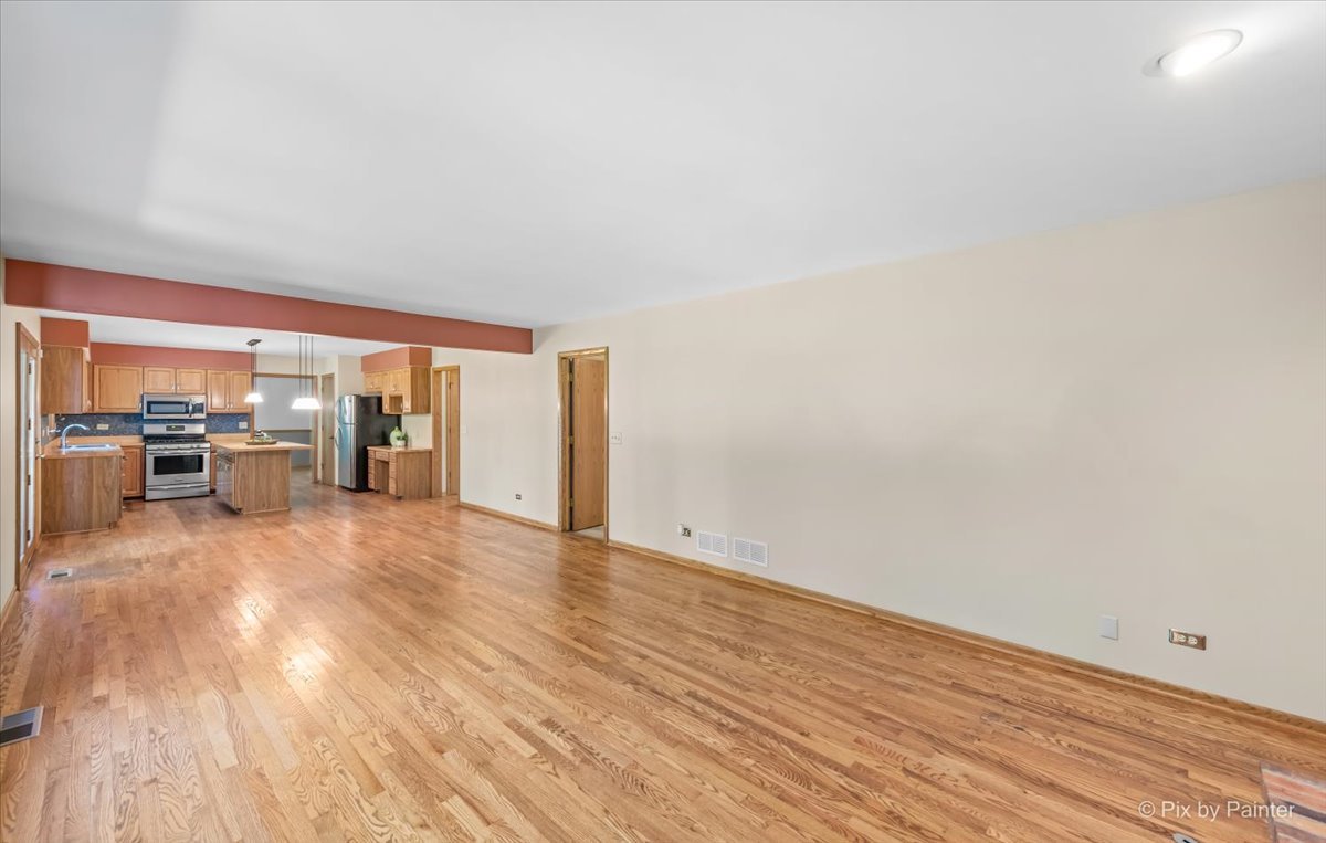 3001 Turnberry Road St. Charles, IL 60174 - Photo 16 of 46 an empty room with wooden floor and windows
