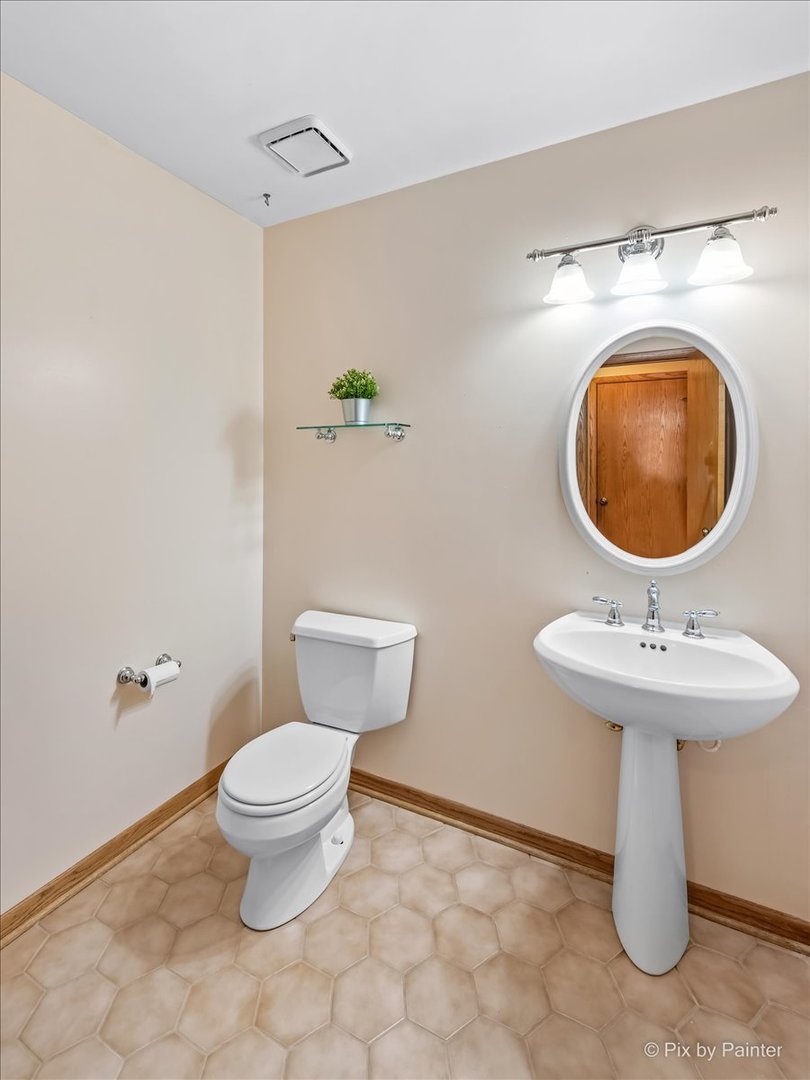 3001 Turnberry Road St. Charles, IL 60174 - Photo 19 of 46 a bathroom with a sink a toilet and a mirror