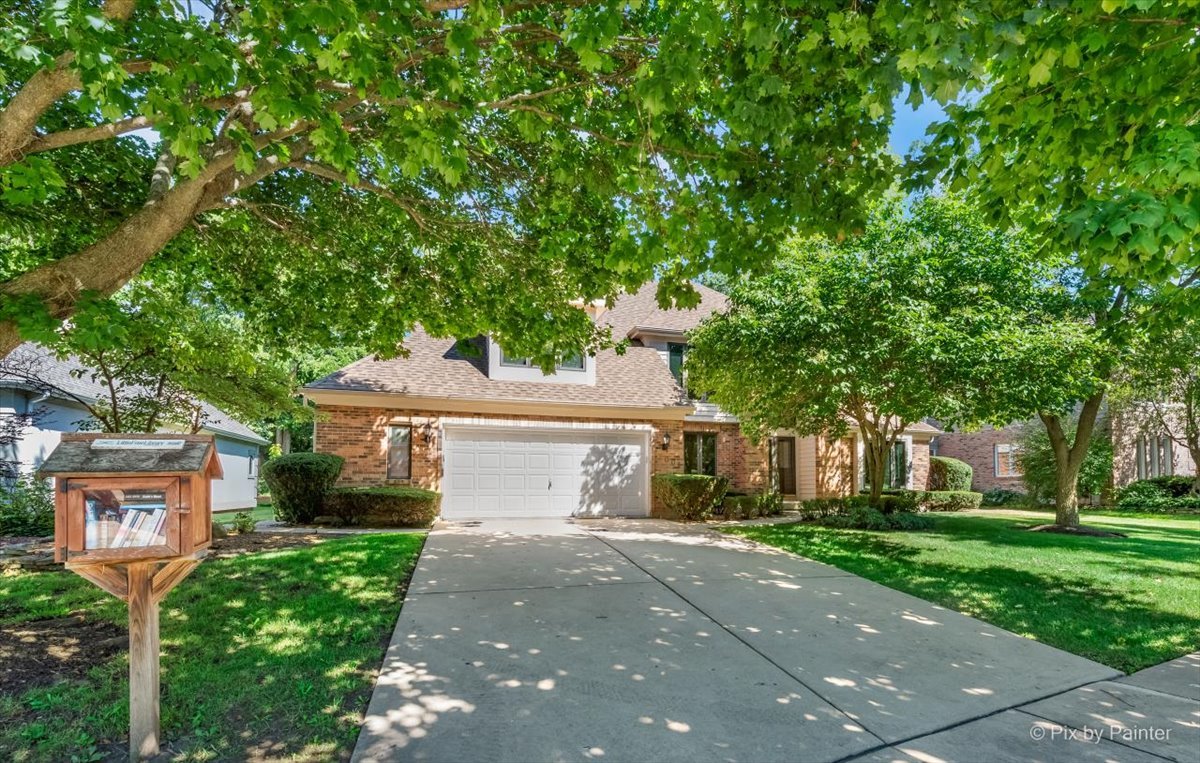 3001 Turnberry Road St. Charles, IL 60174 - Photo 2 of 46 a front view of a house with garden