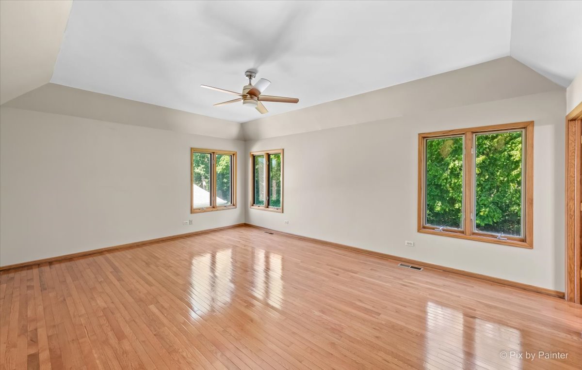 3001 Turnberry Road St. Charles, IL 60174 - Photo 23 of 46 a view of an empty room with a window and wooden floor