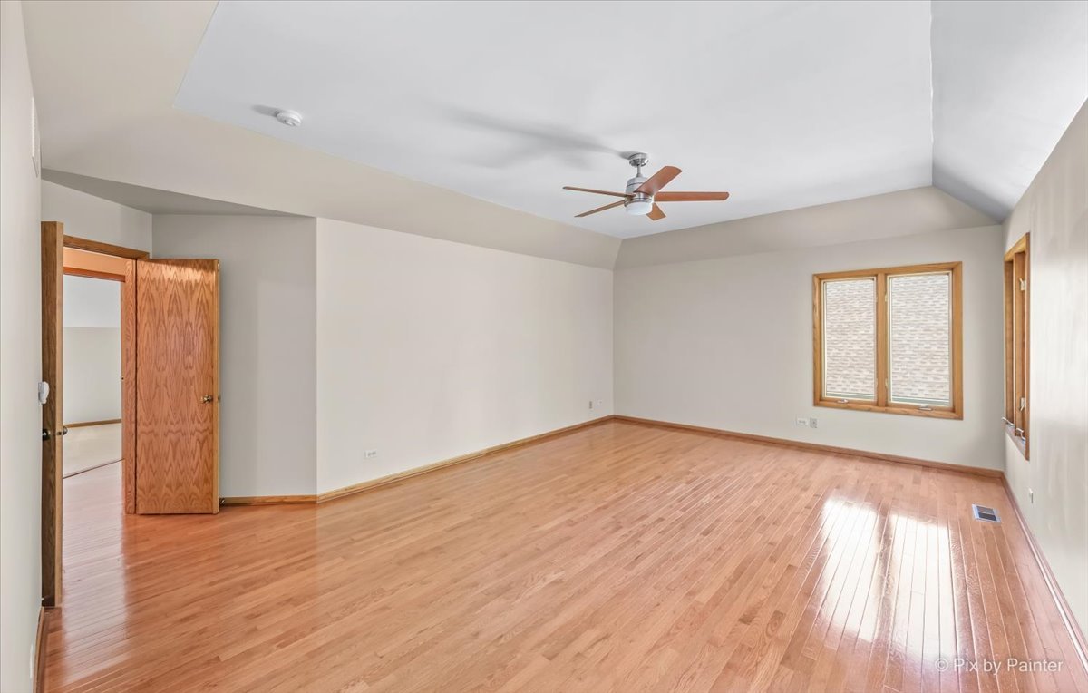 3001 Turnberry Road St. Charles, IL 60174 - Photo 24 of 46 wooden floor in an empty room with a window