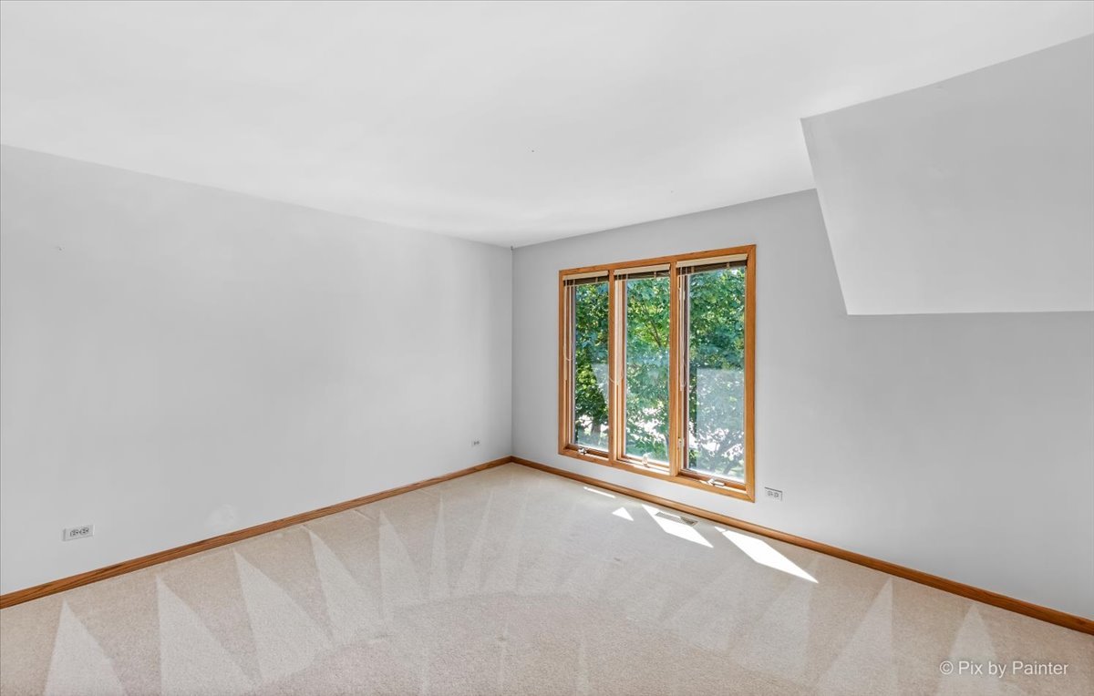 3001 Turnberry Road St. Charles, IL 60174 - Photo 29 of 46 wooden floor in an empty room with a window