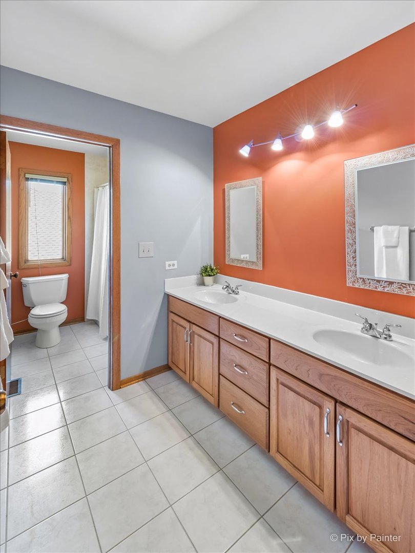 3001 Turnberry Road St. Charles, IL 60174 - Photo 34 of 46 a spacious bathroom with a sink a mirror and a toilet