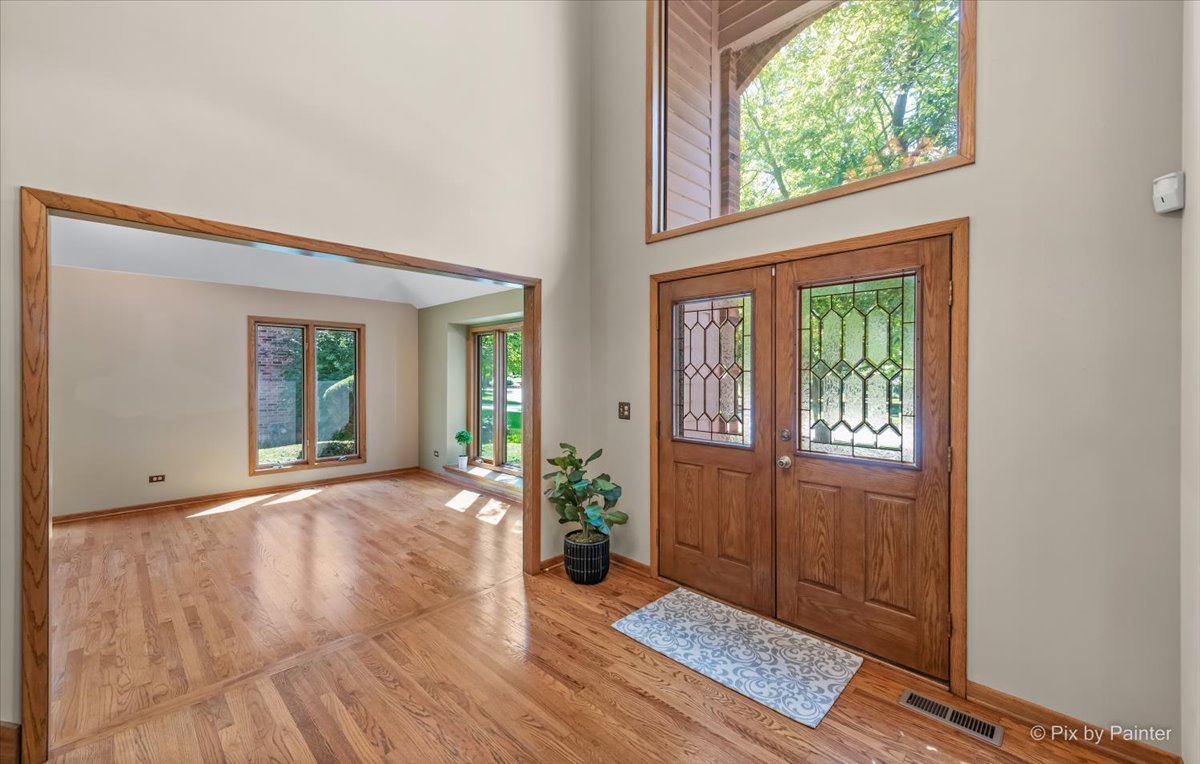 3001 Turnberry Road St. Charles, IL 60174 - Photo 6 of 46 a view of an entrance with wooden floor and a window