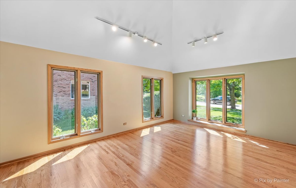 3001 Turnberry Road St. Charles, IL 60174 - Photo 7 of 46 a view of an empty room with wooden floor and a window