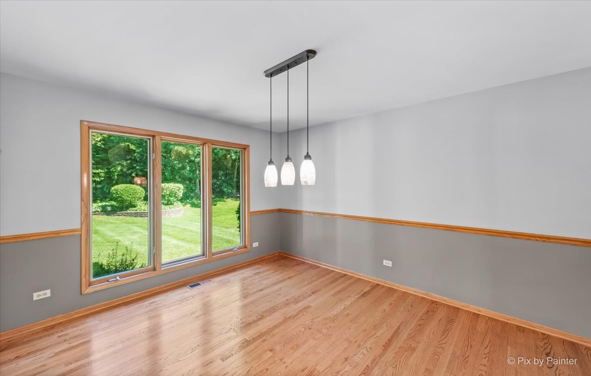 3001 Turnberry Road St. Charles, IL 60174 - Photo 9 of 46 a view of an empty room with wooden floor and a window