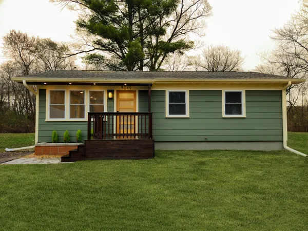 front view of a house with a yard