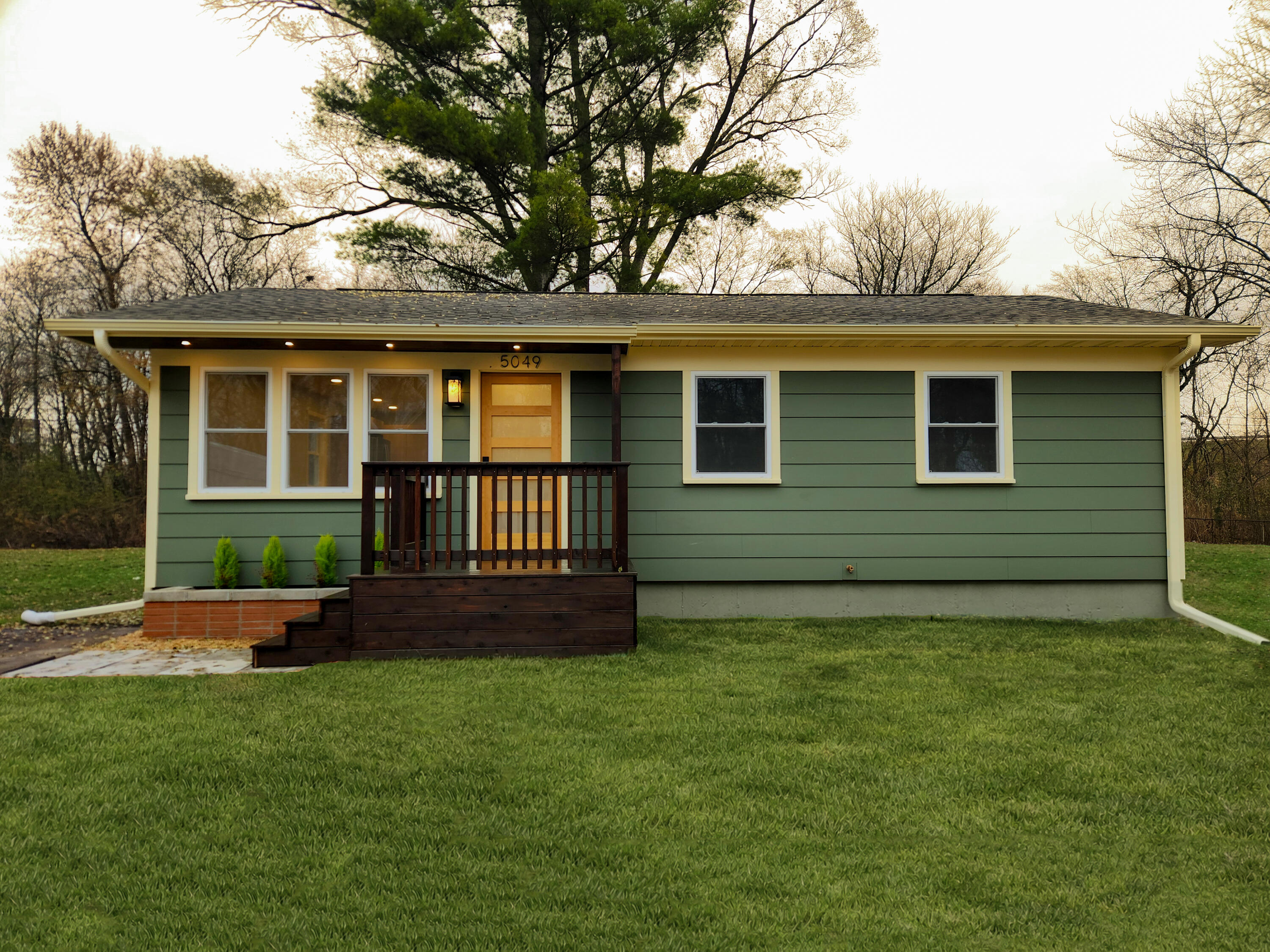 front view of a house with a yard
