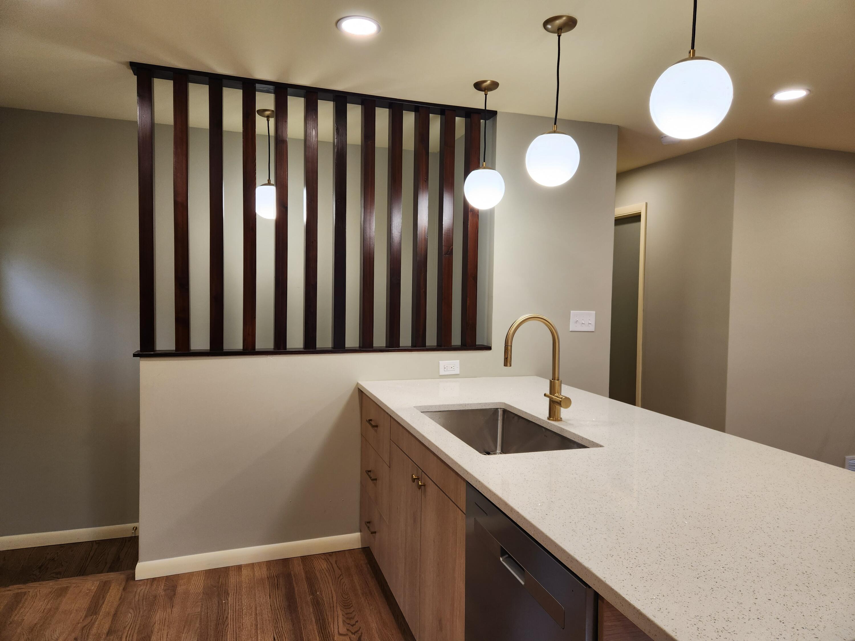 5049 Indiana Place Gary, IN 46409 - Photo 11 of 23 a kitchen with a refrigerator and a sink