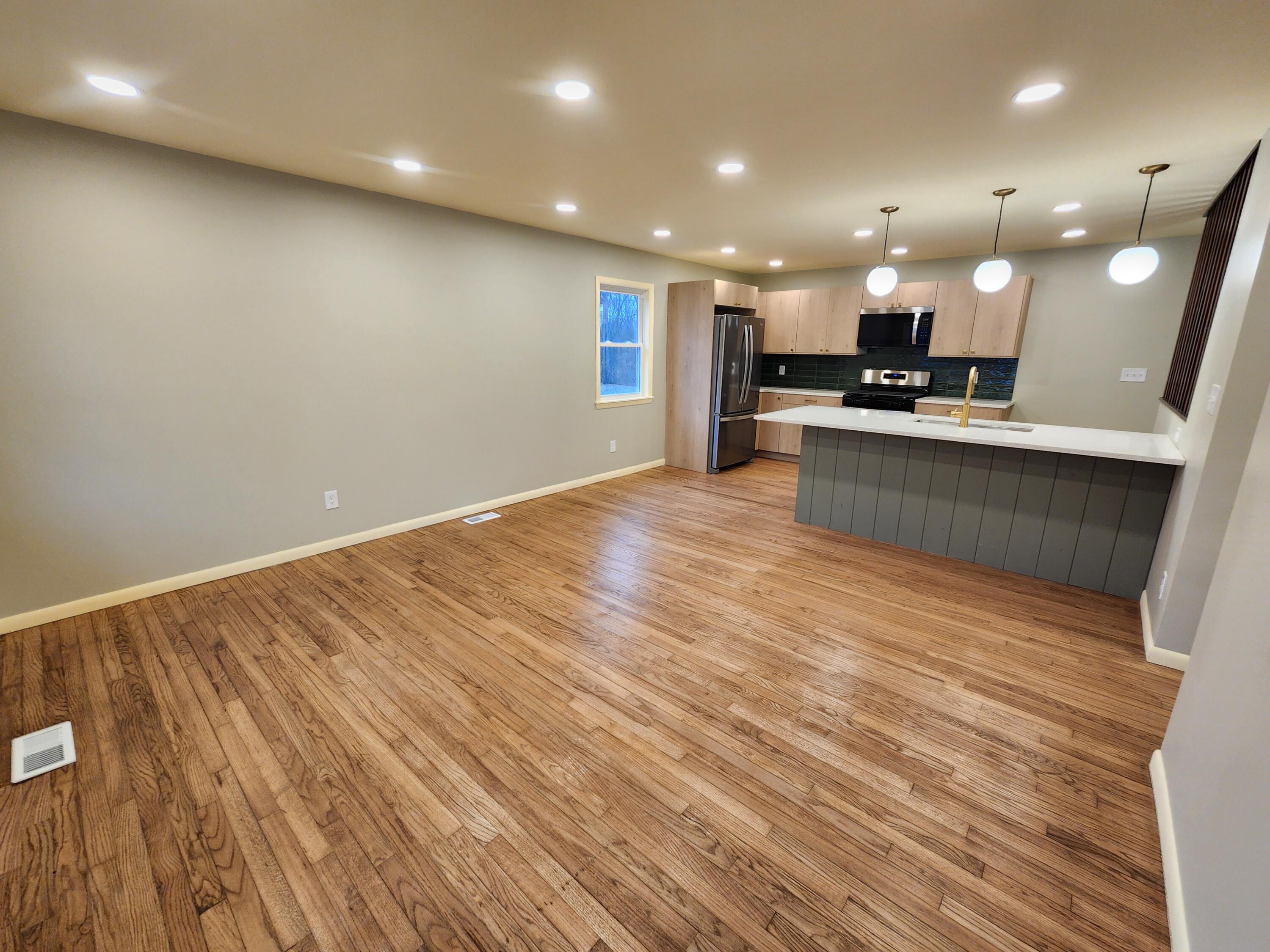 5049 Indiana Place Gary, IN 46409 - Photo 6 of 23 a view of kitchen with kitchen island and stainless steel appliances