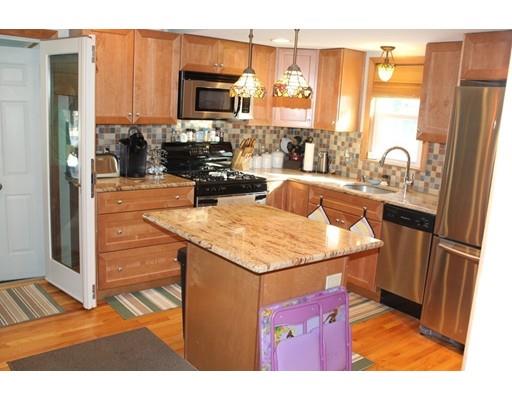 46 Manatee Road Weymouth, MA 02189 - Photo 11 of 29 a kitchen with a sink refrigerator and microwave