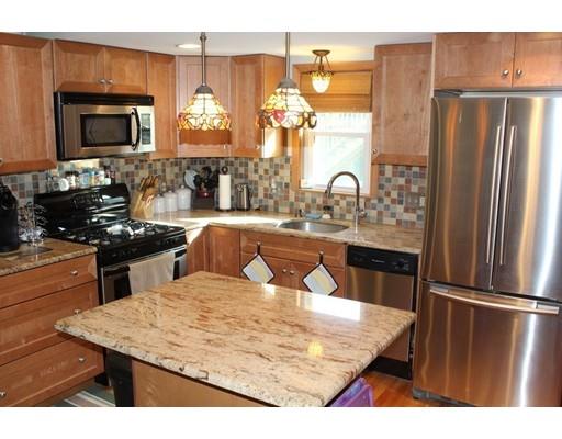 46 Manatee Road Weymouth, MA 02189 - Photo 12 of 29 a kitchen with stainless steel appliances granite countertop a refrigerator stove top oven and sink