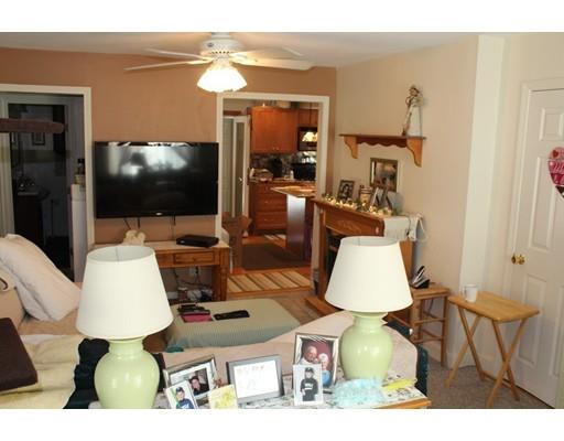 46 Manatee Road Weymouth, MA 02189 - Photo 22 of 29 a living room with furniture and a flat screen tv
