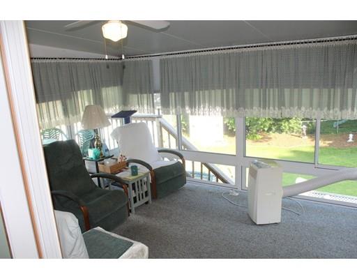 46 Manatee Road Weymouth, MA 02189 - Photo 10 of 29 a dining room with furniture and a garden