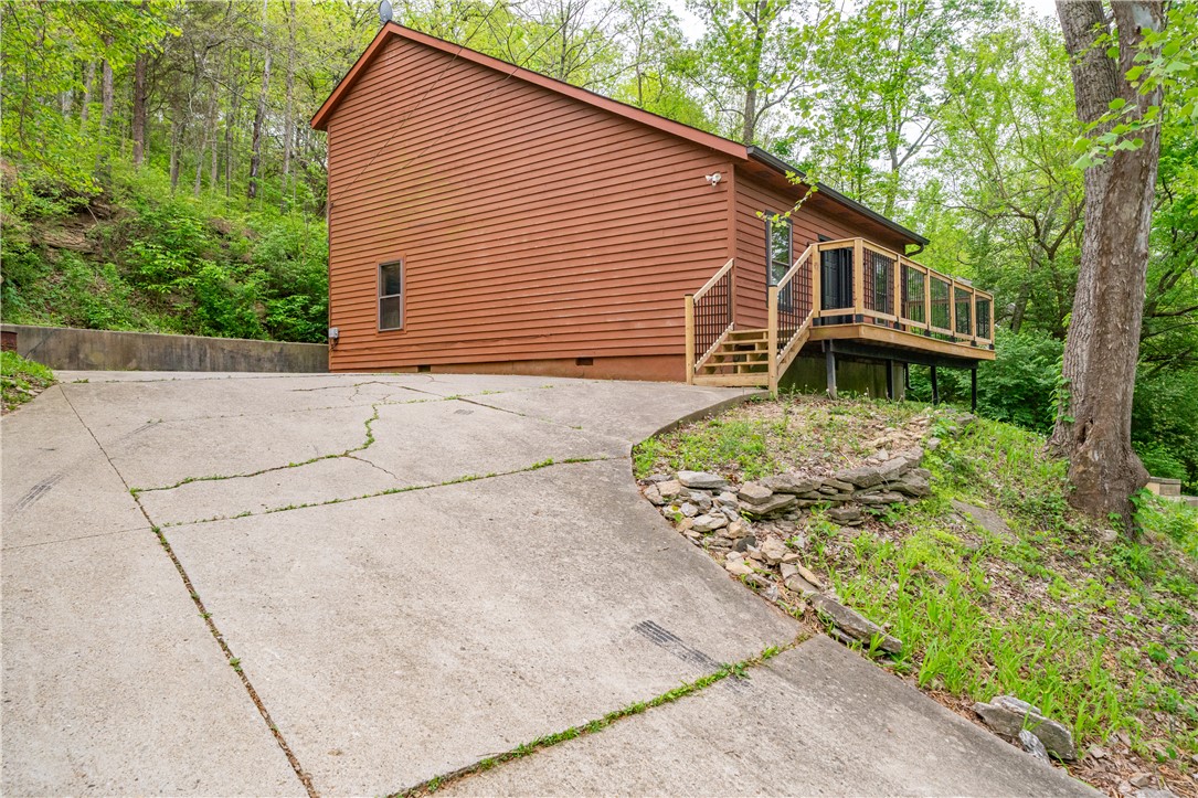10584 New Biddinger Road Harrison, OH 45030 - Photo 37 of 61 This secluded hillside retreat offers a private deck and serene natural surroundings.