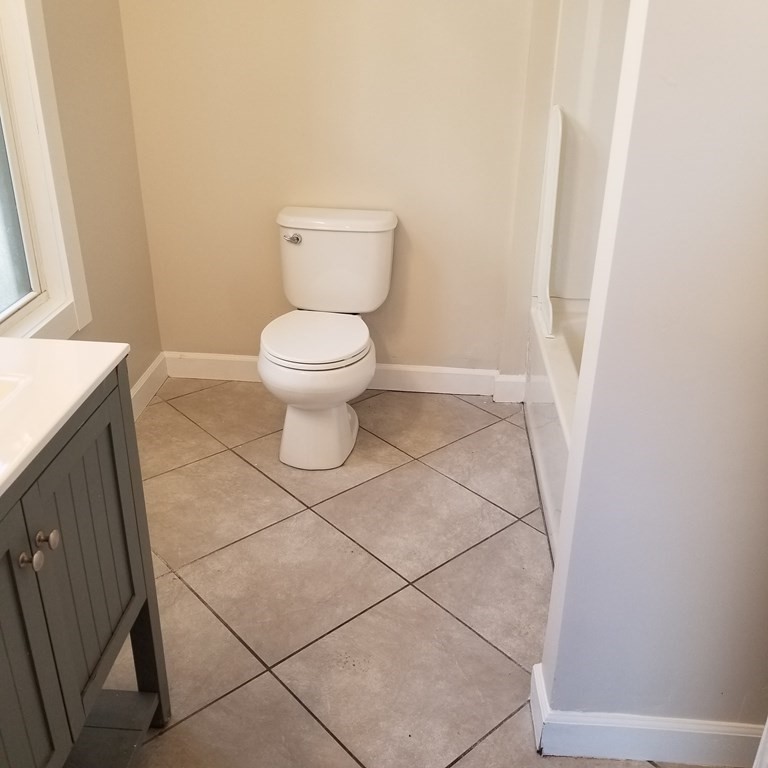 82 Temple Street Springfield, MA 01105 - Photo 5 of 14 a bathroom with a toilet and a shower