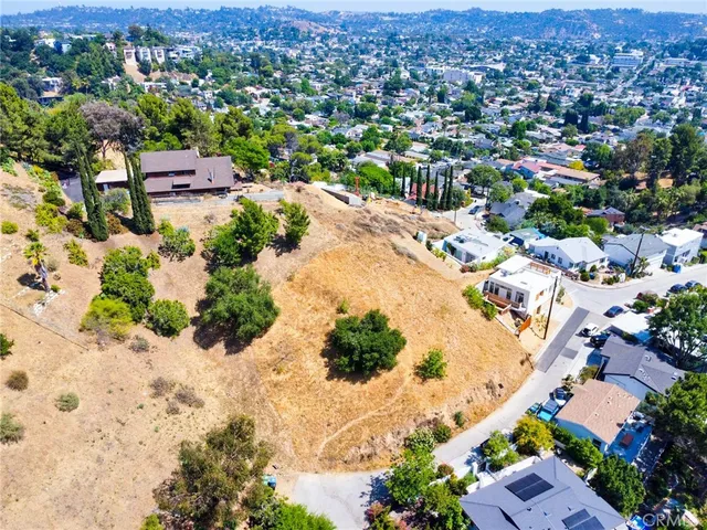 an aerial view of residential house with outdoor space