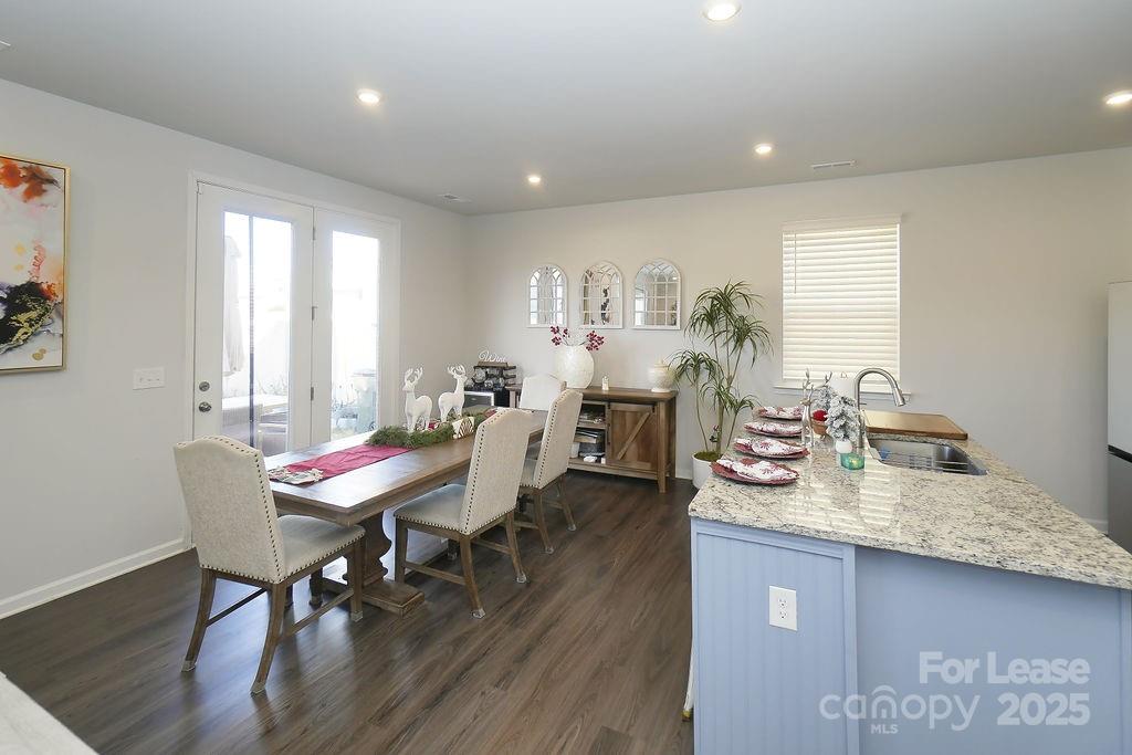 547 Sitka Drive York, SC 29745 - Photo 7 of 20 a view of a dining room with furniture and wooden floor