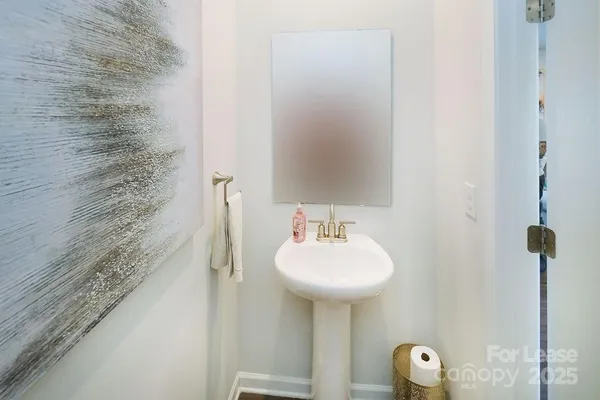 a bathroom with a sink and mirror