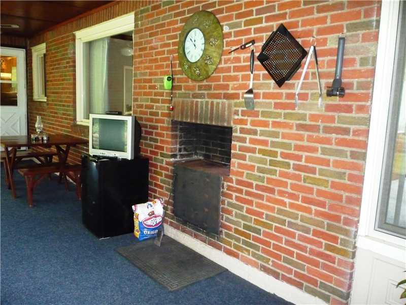303 Dailey Road Brentwood, PA 15227 - Photo 23 of 25 Patio/Deck. Rear porch has own log burning fire place