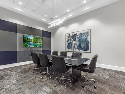 a large white bathroom with a large tub