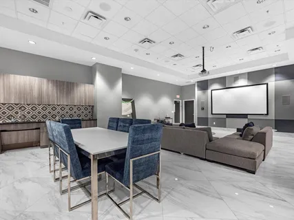a large living room with a couch and a flat screen tv