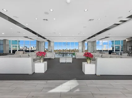 a living room with a kitchen and a couch