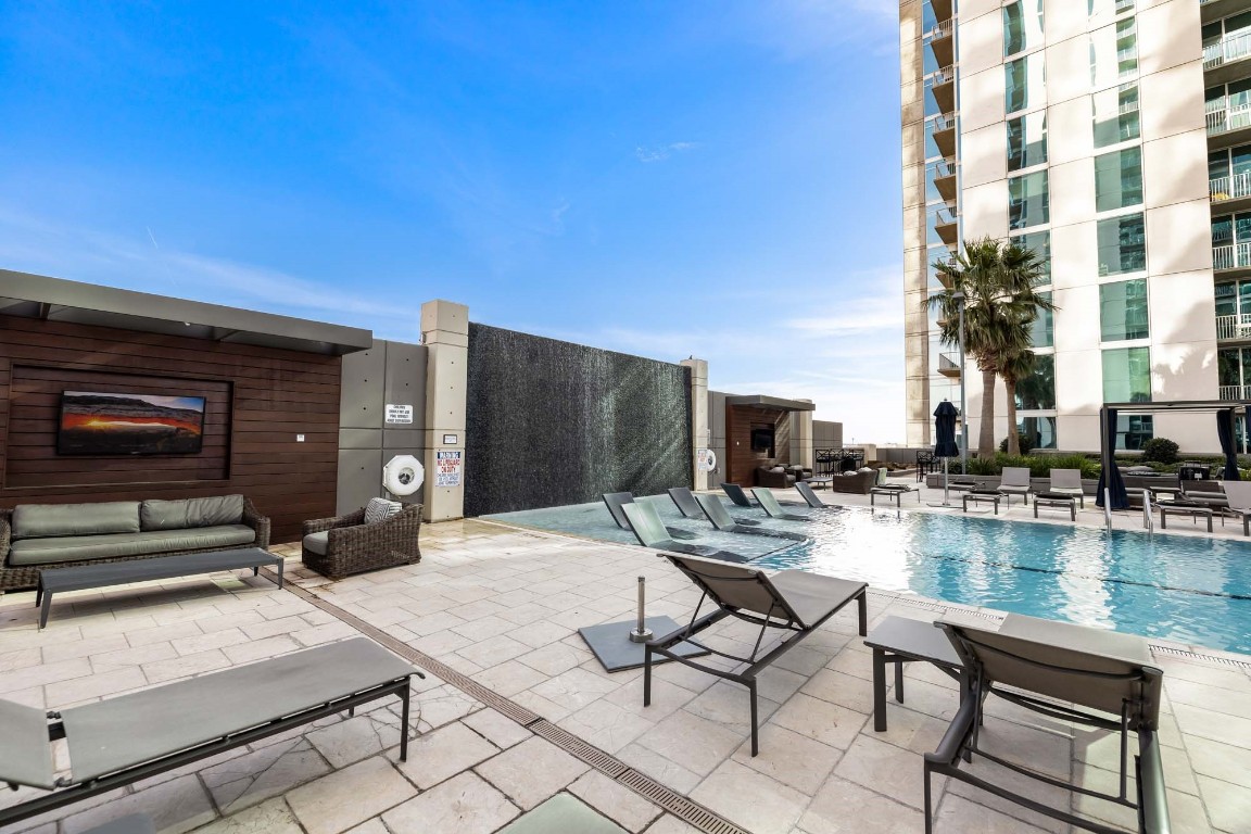 5925 Almeda Road, Unit 11907 Houston, TX 77004 - Photo 24 of 35 a swimming pool with outdoor seating and yard