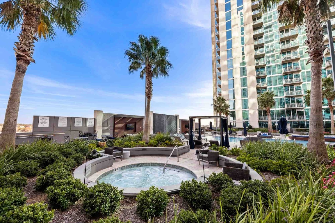 5925 Almeda Road, Unit 11907 Houston, TX 77004 - Photo 26 of 35 a swimming pool with outdoor seating and yard