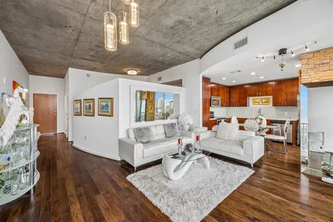 a living room with furniture and a rug